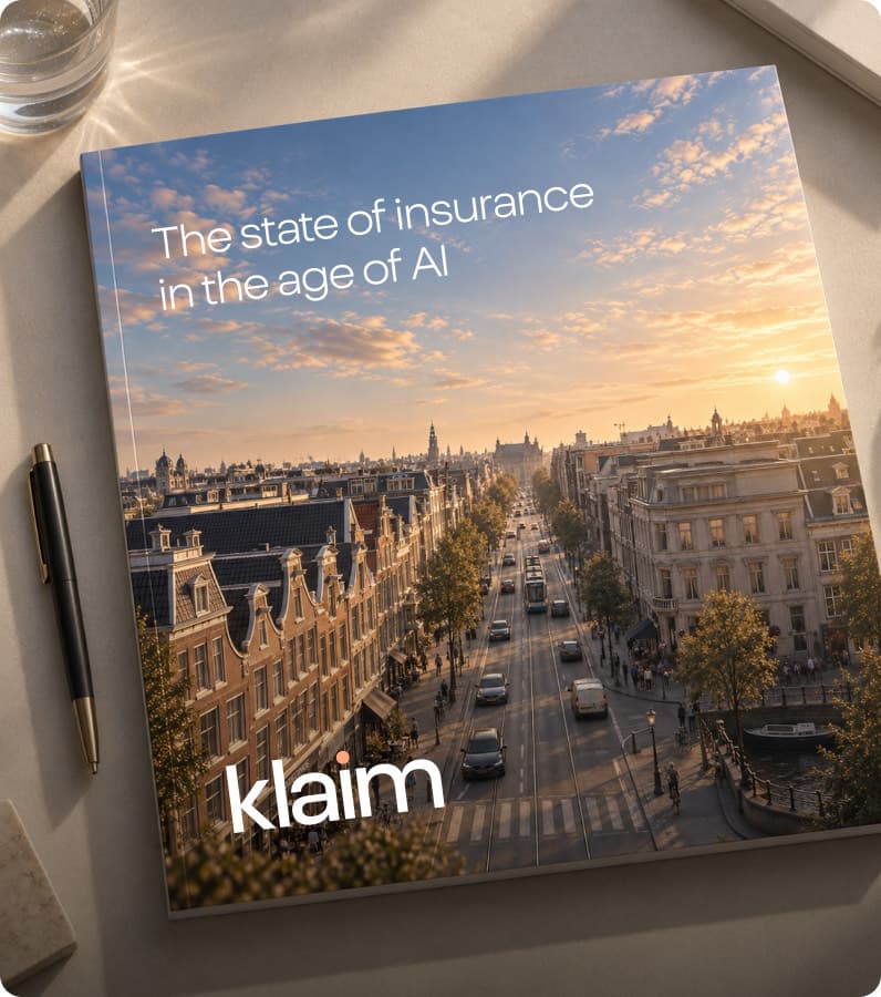 The printed report on a desk, its cover showing an Amsterdam street at sunset.